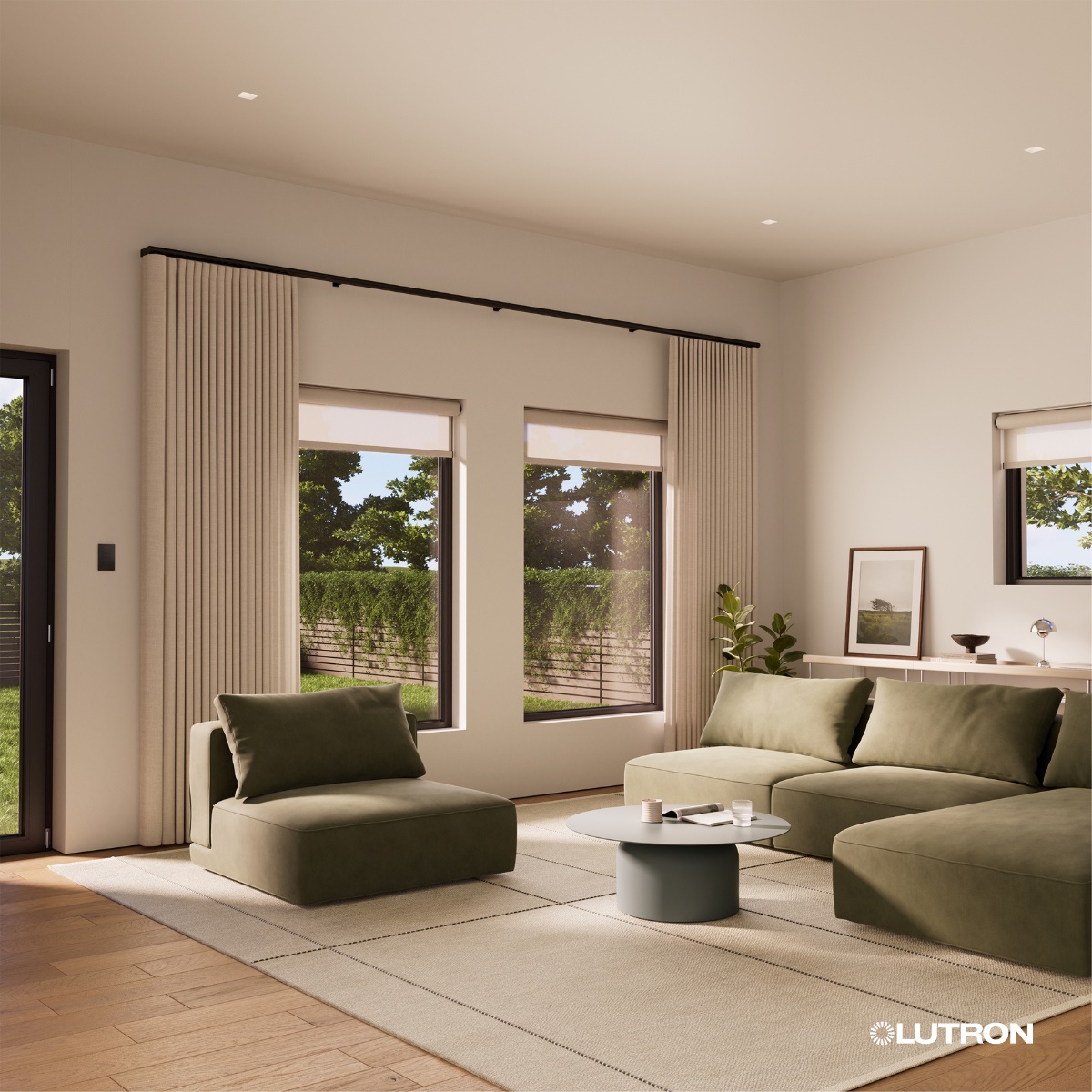 Motorized ripple fold drapery on an exposed black Palladiom rod spanning a living room wall of windows, layered over Lutron roller shades