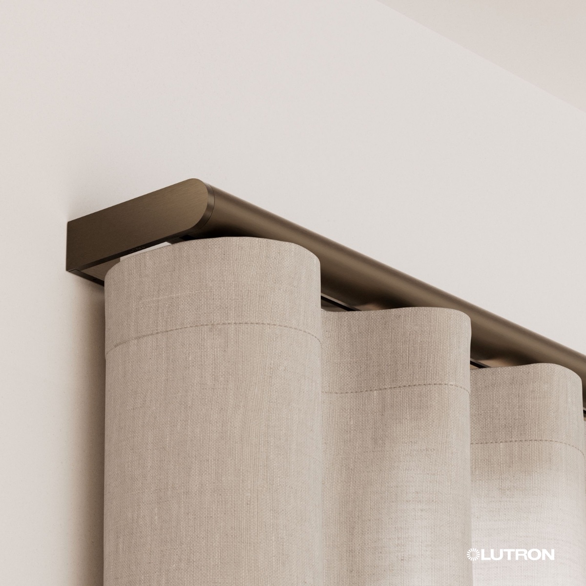 Bronze Anodized end cap on a Palladiom drapery rod carrying natural linen ripple fold drapery